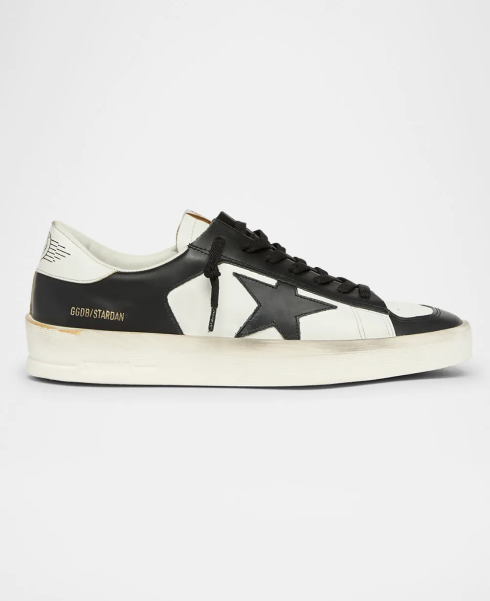 Black and white leather sneaker with star patch and cream sole, labeled GGDB/STARDAN
